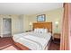 Comfortable main bedroom featuring a cozy bed, storage, and a connecting bathroom at 504 N Ocean Blvd. N # 309, Myrtle Beach, SC 29577