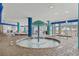 Indoor pool featuring a shallow fountain section, tile flooring, and comfortable lounge seating at 504 N Ocean Blvd. N # 309, Myrtle Beach, SC 29577