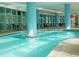Indoor pool with clear water and ample seating and shade at 504 N Ocean Blvd. N # 309, Myrtle Beach, SC 29577