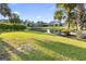 Well-maintained backyard featuring a pond, lush grass, and mature trees at 523 Stonemason Dr., Myrtle Beach, SC 29579