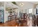 Elegant dining room with a round glass table, decorative chairs, and views into the kitchen at 523 Stonemason Dr., Myrtle Beach, SC 29579
