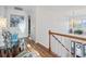 Bright hallway featuring hardwood floors, a chandelier, and stairway access at 523 Stonemason Dr., Myrtle Beach, SC 29579