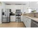 Well-equipped kitchen with stainless steel appliances, white cabinetry, and ample counter space at 523 Stonemason Dr., Myrtle Beach, SC 29579