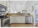 Bright kitchen featuring stainless steel appliances, white cabinets, and tile backsplash at 523 Stonemason Dr., Myrtle Beach, SC 29579