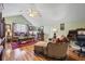 Cozy living room featuring hardwood floors, comfortable seating, and a writing desk at 523 Stonemason Dr., Myrtle Beach, SC 29579