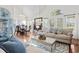 Well-lit living room with hardwood floors, vaulted ceilings, and an open layout to the dining area at 523 Stonemason Dr., Myrtle Beach, SC 29579