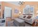 Bright living room featuring hardwood floors, modern decor, and lots of natural light from large shuttered windows at 523 Stonemason Dr., Myrtle Beach, SC 29579