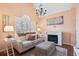 Comfortable living room with a cozy fireplace, vaulted ceilings, and soft natural light at 523 Stonemason Dr., Myrtle Beach, SC 29579