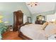 Comfortable main bedroom featuring hardwood floors, a king-sized bed, and decorative wooden furniture at 523 Stonemason Dr., Myrtle Beach, SC 29579