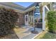 Cozy screened porch featuring outdoor seating and a view of the landscaped yard at 523 Stonemason Dr., Myrtle Beach, SC 29579