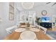 Bright dining area features an elegant table, decorative pendant light, and a view into the bathroom at 5750 Oyster Catcher Dr. # 333, North Myrtle Beach, SC 29582
