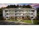 Well-maintained condo building features multiple floors and private balconies, surrounded by lush landscaping and a paved parking lot at 5750 Oyster Catcher Dr. # 333, North Myrtle Beach, SC 29582