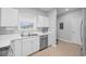 Kitchen featuring white cabinets, stainless steel appliances, a window, and ample counter space, blending style and functionality at 5750 Oyster Catcher Dr. # 333, North Myrtle Beach, SC 29582