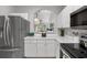 Bright kitchen with white countertops and white cabinets showcasing stainless steel appliances and a view into the living area at 5750 Oyster Catcher Dr. # 333, North Myrtle Beach, SC 29582