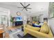Bright living area with hardwood floors, a ceiling fan, comfortable seating, and access to the outdoors through sliding glass doors at 5750 Oyster Catcher Dr. # 333, North Myrtle Beach, SC 29582
