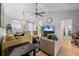 Open-concept living area with hardwood floors, ceiling fan, and a view into the kitchen and dining area at 5750 Oyster Catcher Dr. # 333, North Myrtle Beach, SC 29582