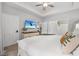 Bright main bedroom featuring a TV, closet, soft carpet, and modern decor at 5750 Oyster Catcher Dr. # 333, North Myrtle Beach, SC 29582