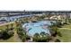 Large, inviting community pool surrounded by tropical foliage and lounge chairs at 5750 Oyster Catcher Dr. # 333, North Myrtle Beach, SC 29582