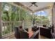 Cozy screened porch featuring comfortable seating and a tranquil view of the lush surroundings at 5750 Oyster Catcher Dr. # 333, North Myrtle Beach, SC 29582