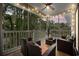 Inviting screened porch with stylish wicker furniture, perfect for enjoying the outdoors at 5750 Oyster Catcher Dr. # 333, North Myrtle Beach, SC 29582
