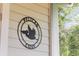 Close-up of the 'Pelican Cove' sign, adding a touch of coastal charm to the property at 5750 Oyster Catcher Dr. # 333, North Myrtle Beach, SC 29582