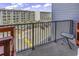 Balcony view overlooking the parking lot and the nearby condo buildings at 5905 South Kings Hwy. # 433, Myrtle Beach, SC 29575
