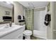 Standard bathroom with a single sink vanity, toilet, and shower-tub combination with decorative curtain at 5905 South Kings Hwy. # 433, Myrtle Beach, SC 29575
