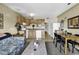 Open kitchen with wood cabinets, white appliances, adjacent dining area and living space at 5905 South Kings Hwy. # 433, Myrtle Beach, SC 29575