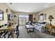 Cozy living room featuring a dining table, floral sofa, and balcony access with a view at 5905 South Kings Hwy. # 433, Myrtle Beach, SC 29575