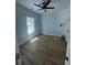 Charming bedroom featuring hardwood floors, a ceiling fan, and ample natural light at 6001 - 1766 S Kings Hwy., Myrtle Beach, SC 29575