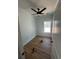 Bright bedroom with hardwood floors, ceiling fan, and large window for natural light at 6001 - 1766 S Kings Hwy., Myrtle Beach, SC 29575