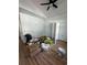 A spacious bedroom with wood floors, crown molding, a fan, and ample natural light at 6001 - 1766 S Kings Hwy., Myrtle Beach, SC 29575