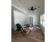 A spacious bedroom with wood floors, crown molding, a fan, and ample natural light at 6001 - 1766 S Kings Hwy., Myrtle Beach, SC 29575