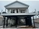 Exterior of a two-story home with black support beams, white siding, and windows at 6001 - 1766 S Kings Hwy., Myrtle Beach, SC 29575