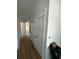 Hallway boasts wood floors, crisp molding, and multiple doorways, creating an open and inviting atmosphere at 6001 - 1766 S Kings Hwy., Myrtle Beach, SC 29575