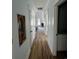 Hallway view of light-colored walls, recessed lighting, and hardwood floors at 6001 - 1766 S Kings Hwy., Myrtle Beach, SC 29575