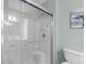 Bright bathroom featuring a glass enclosed shower, white tile, and clean design at 6001 - 1807 S Kings Hwy., Myrtle Beach, SC 29575