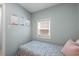 This well-lit bedroom has a window and artwork for a touch of personality at 6001 - 1807 S Kings Hwy., Myrtle Beach, SC 29575