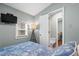 Comfortable bedroom includes TV, window and view to bath, perfect for relaxation at 6001 - 1807 S Kings Hwy., Myrtle Beach, SC 29575