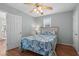 Cozy bedroom with a ceiling fan, wooden floors, a window, and ample natural light at 6001 - 1807 S Kings Hwy., Myrtle Beach, SC 29575