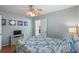 Well-decorated bedroom offering a ceiling fan, wall art, wood floors, and access to the bathroom at 6001 - 1807 S Kings Hwy., Myrtle Beach, SC 29575