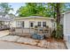 Charming home with inviting front deck, outdoor seating and curb appeal at 6001 - 1807 S Kings Hwy., Myrtle Beach, SC 29575