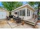 Charming beach home featuring a spacious wooden deck, convenient parking, and storage shed with a grill and patio set at 6001 - 1807 S Kings Hwy., Myrtle Beach, SC 29575