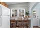 Well-lit kitchen with bar seating, tile flooring, and open layout perfect for entertaining at 6001 - 1807 S Kings Hwy., Myrtle Beach, SC 29575