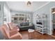 Inviting living room filled with natural light, featuring stylish seating, laminate flooring, and a cozy ambiance at 6001 - 1807 S Kings Hwy., Myrtle Beach, SC 29575