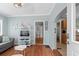 Cozy living room with hardwood floors, modern furniture, and an open view into the kitchen at 6001 - 1807 S Kings Hwy., Myrtle Beach, SC 29575