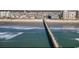 Aerial view showcasing the pier with ocean waves and surrounding beach condos at 6001 N Ocean Blvd. # 342, North Myrtle Beach, SC 29582