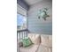 Inviting balcony with comfortable seating, decorated with turtle wall art, offering a scenic view of the ocean at 6001 N Ocean Blvd. # 342, North Myrtle Beach, SC 29582