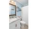 Well-lit bathroom featuring a granite countertop vanity and a shower with a white curtain at 6001 N Ocean Blvd. # 342, North Myrtle Beach, SC 29582