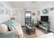 Bright and airy living room featuring comfortable seating and access to a balcony with ocean views at 6001 N Ocean Blvd. # 342, North Myrtle Beach, SC 29582